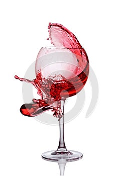 Splash of red wine in glass