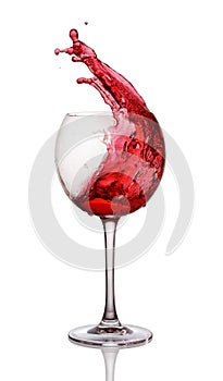 Splash of red wine in glass