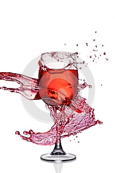 Splash of red wine in glass