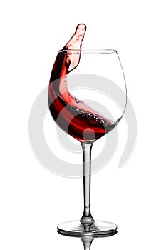 Splash in red wine in a glass