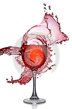 Splash of red wine in glass