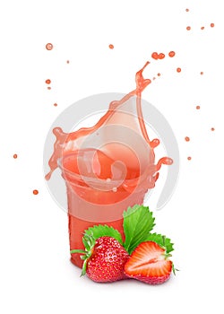 Splash of strawberry juice in a plastic glass with strawberries