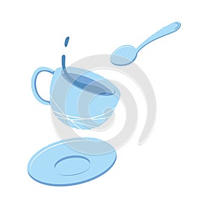 Splash of tea in a mug, saucer and spoon. The concept of teatime