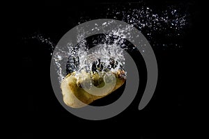 A splash of water from a fallen pear