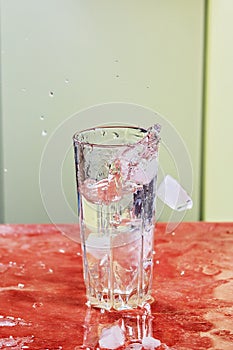 Splash of water in kitchen glass