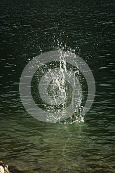 Splash of water with thousands of droplets photo