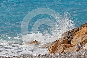 Splash of wave against wavebreaker