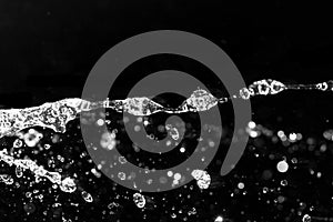 Splashes inlets on a black background photo