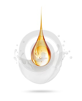Splashes of milk or cream with oily drop close-up isolated on a white background photo