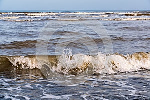 Splashes of sea waves on the shore. Freshness of nature