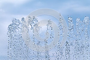 Splashes of water against the blue sky background