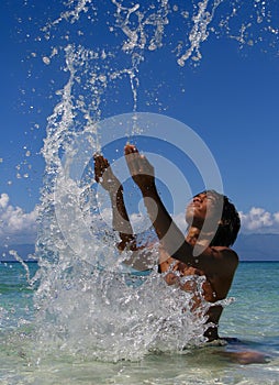 Splashing exotic boy