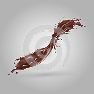 Splashing liquid chocolate on a gray background