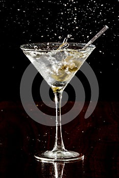 Splashing martini olives