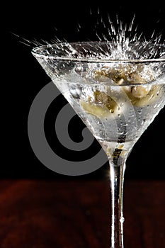 Splashing martini olives