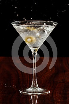 Splashing martini olives