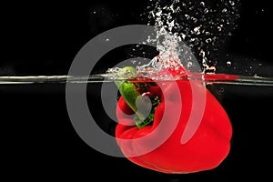 Splashing peper into a water