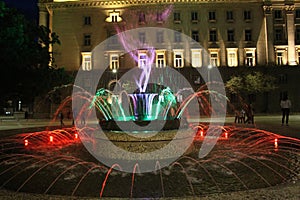 Splashing water from the bigger fountain in Sofia in front of the presidency in the center night beautiful Sofia