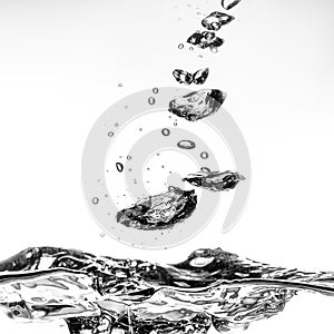 splashing water with bubbles on white background closeup