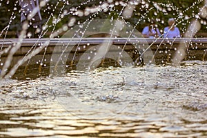 Splashing water in fountain. Water jets of pure clear aqua splashes, pressure