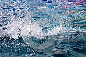 Splashing water in the pool as a background