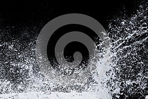 Splashing water of sea wave from strom crashing on shore spraying white water foam