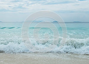 Splashing Waves from The Blue Sea to The Clear White Sand Beach in Myanmar with Copyspace to input Text