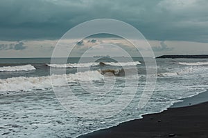 Splashing waves and cloudy sky on a pebble beach in Batumi. Autonomous Republic of Adjara  Georgia