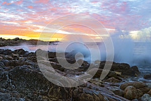 Splashing Waves on Sunset at O`Sullivan Beach, South Australia photo