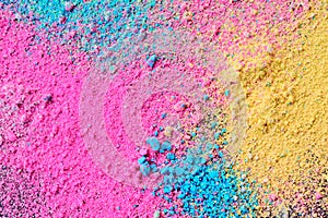 A splatter of pastel natural colored pigment powder on black background