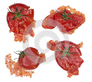 Splattered tomatoes isolated on white photo