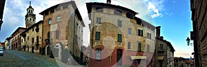 Splendid ancient street in Saluzzo town, Piedmont region, Italy. Colours, history, enchanting architecture and art