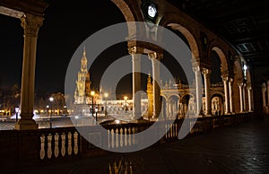 The splendid architecture of the Plaza de Espana in Seville illuminated on a beautiful spring night