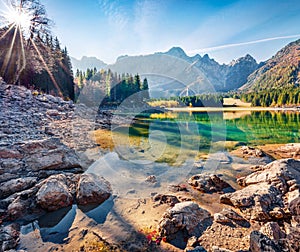 Splendid autumn view of Fusine lake. Bright morning scene of Julian Alps with Mangart peak on background, Province of Udine, Italy