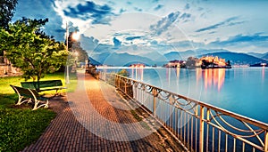 Splendid evening cityscape of Stresa town. Wonderful summer susnset on Maggiore lake with Bella island on background, Province of