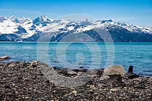 Splendid landscape of the Glacier Bay in Alaska with high snow covered mountains a blue green sea