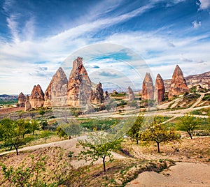 Splendid morning view of of Red Rose valley. Nice spring scene of Cappadocia. Cavusin village located, district of Nevsehir, Turke