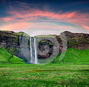 Splendid morning view of Seljalandfoss Waterfall on Seljalandsa rive. Great summer sunrise in Iceland, Europe. Beauty of nature