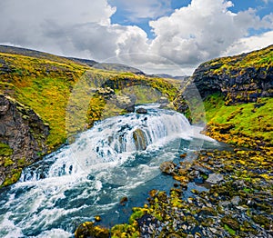 Splendid summer scene of waterfall on Skoga river. Aerial summer view from the tourist trek from famous Skogafoss waterfall to the