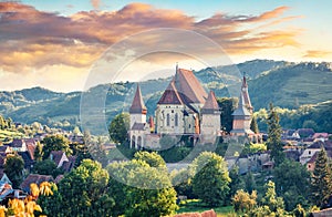 Splendid summer view of Fortified Church of Biertan, UNESCO World Heritage Sites since 1993. Colorful morning cityscape of Biertan