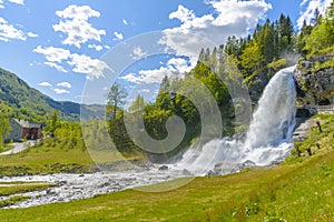 Splendid summer view with popular waterfall Steinsdalsfossen on