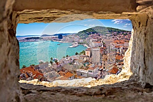 Split bay aerial view through stone window