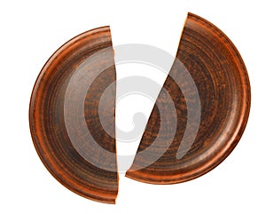 The split clay plate is isolated on a white background. A broken dish