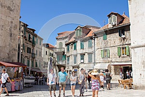 SPLIT, CROATIA - Aug 10, 2011: Tourists on a square in Split, Croatia