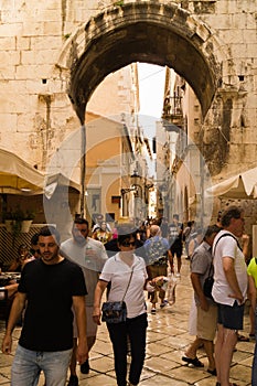 Split, Dalmatia, Croatia; 09/07/2018: Tourists walk in the old district of Split.