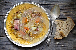 Split pea soup on vintage wooden table