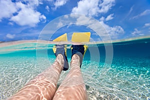 Split photo of woman legs with fins photo