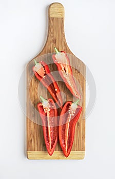 Split Red Peppers on Wooden Cutting Board