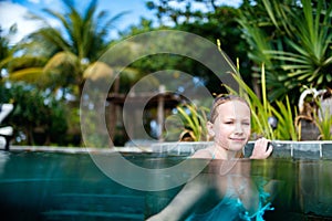 Little girl in swimming pool