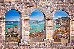 Split waterfront aerial panoramic view through stone window